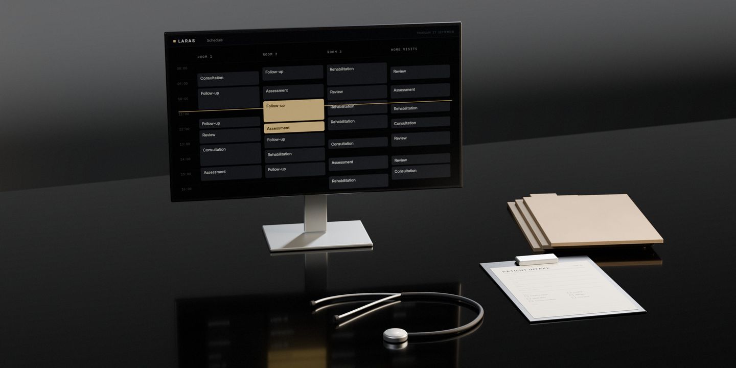 A patient intake form on a clipboard with a stethoscope beside it, record folders, and a screen showing the day’s rooms and appointments, on a dark stone desk