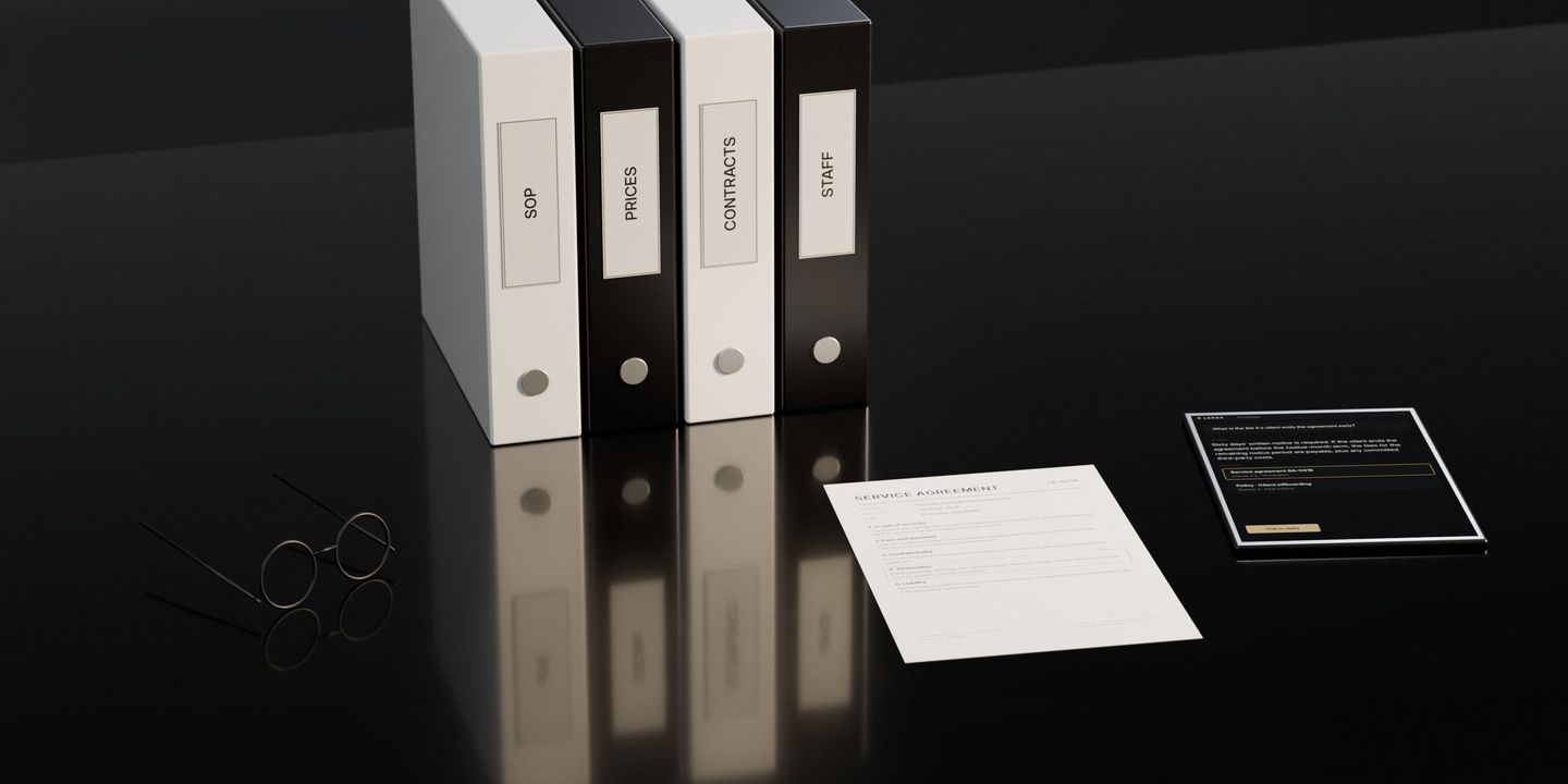 Four labelled binders standing on a dark stone desk, an agreement open with one clause marked, a pair of glasses, and a tablet showing the answer with its source
