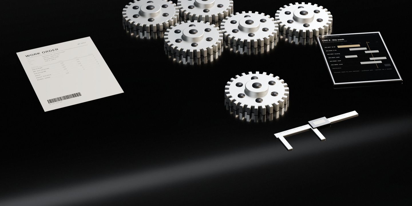 A cut steel gear beside a caliper on a dark stone desk, the rest of the run behind it, the work order it belongs to, and the production plan live on a tablet